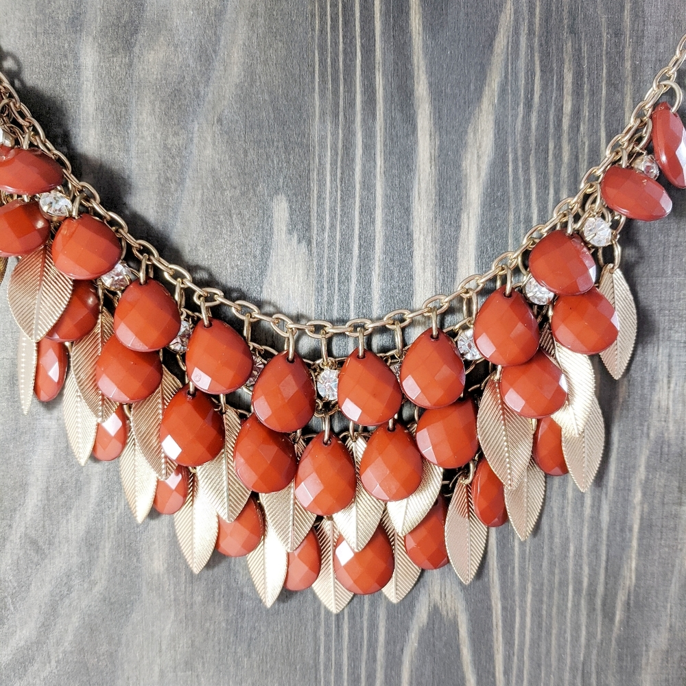 Multi-Layered Rhinestone, Red Faceted Drop Bead And Gold Tone Leaf Necklace